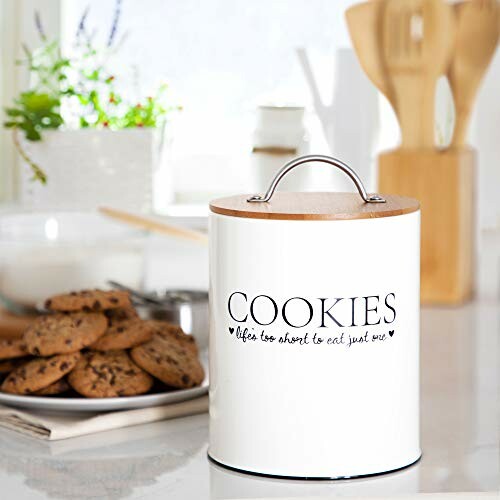 Cookie jar labeled 'cookies' with a plate of cookies nearby