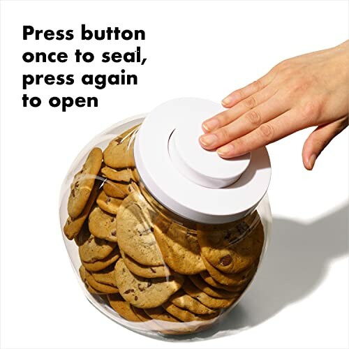 Hand pressing lid on a cookie jar