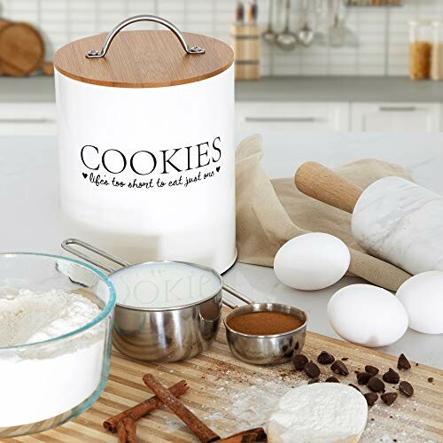 Baking ingredients on a kitchen counter with a cookie jar