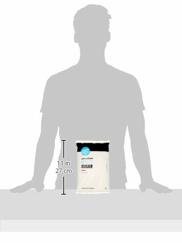 Silhouette of a person with a bag of sugar on a table.